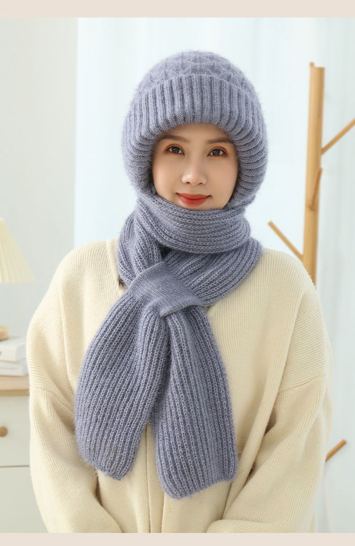 Woman wearing a knit hood with scarf