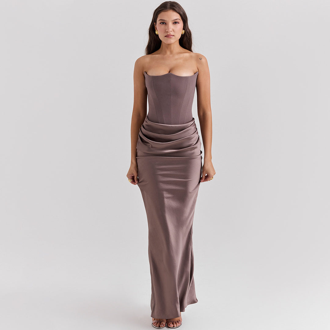 Woman in a strapless satin maxi gown