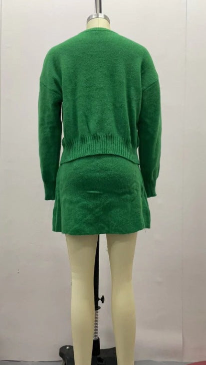 Woman in matching knit sweater and mini skirt set