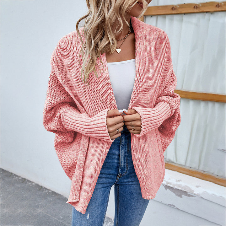 Woman in oversized batwing knit cardigan