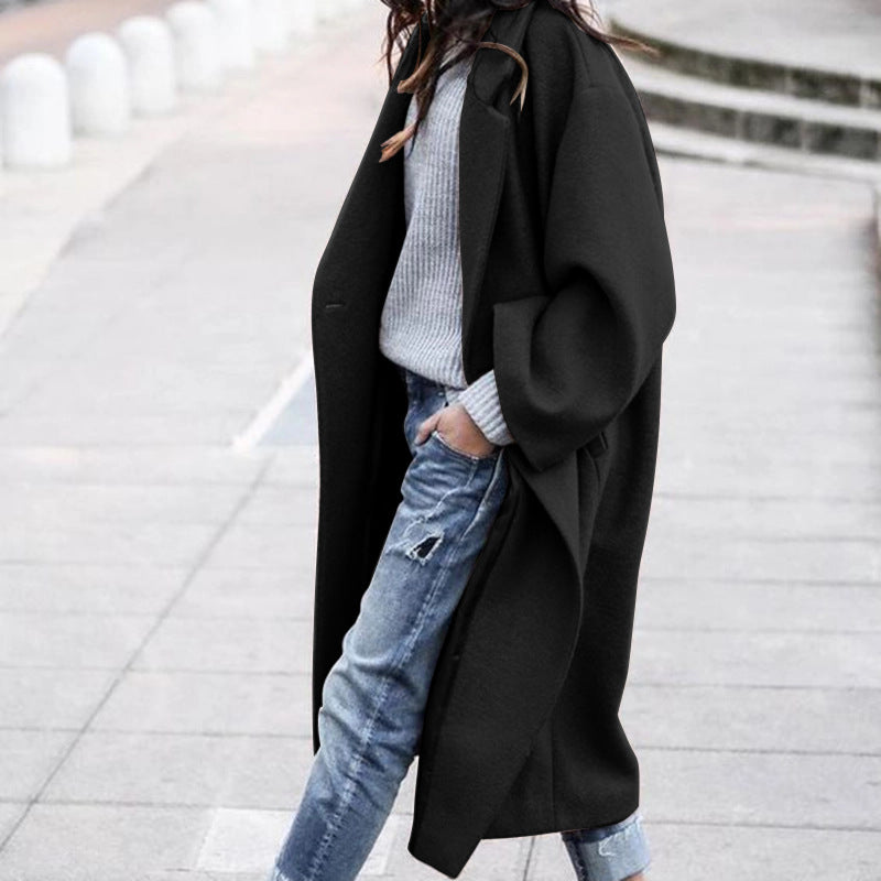 Woman in long oversized lapel coat