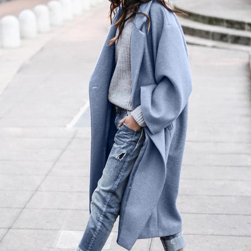 Woman in long oversized lapel coat