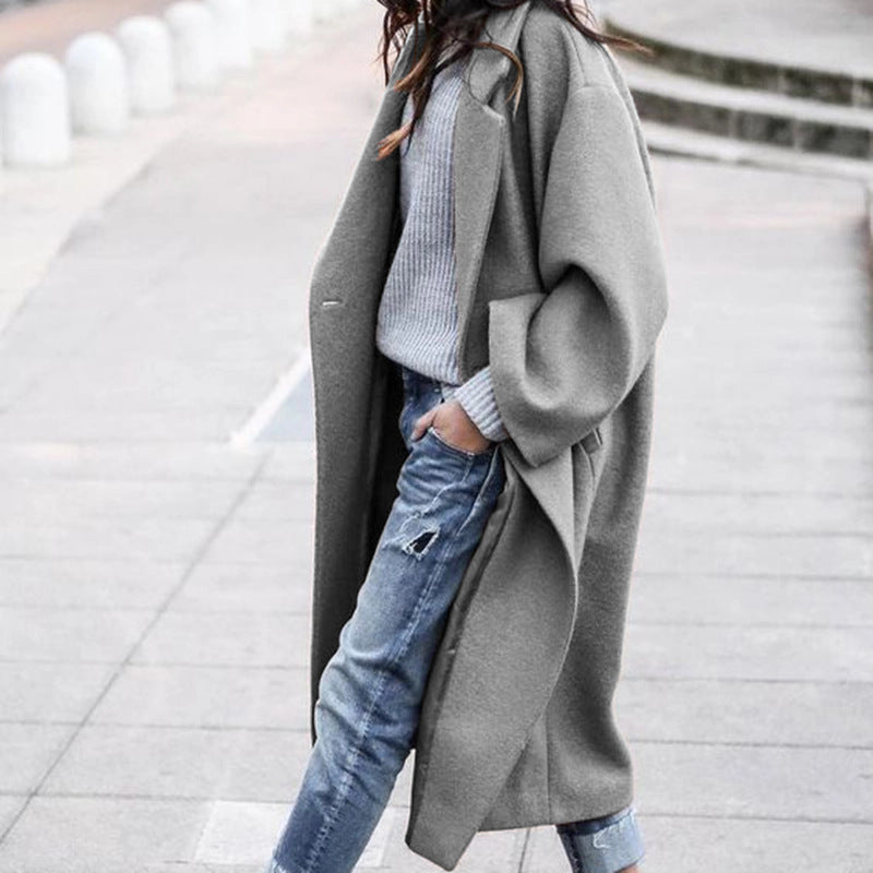 Woman in long oversized lapel coat