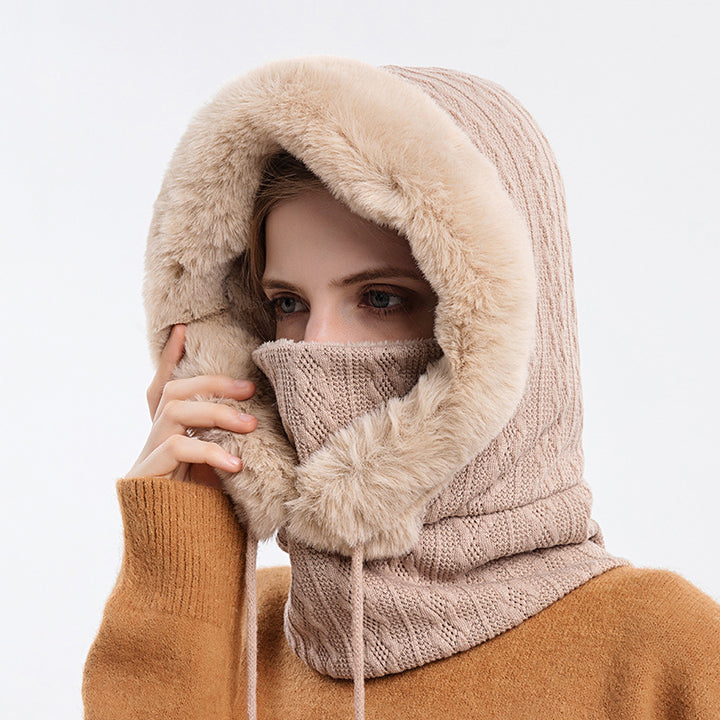 Woman wearing knit hood with faux fur trim