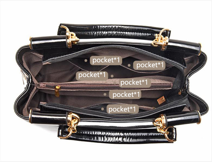 Sequin embroidered patent leather handbag