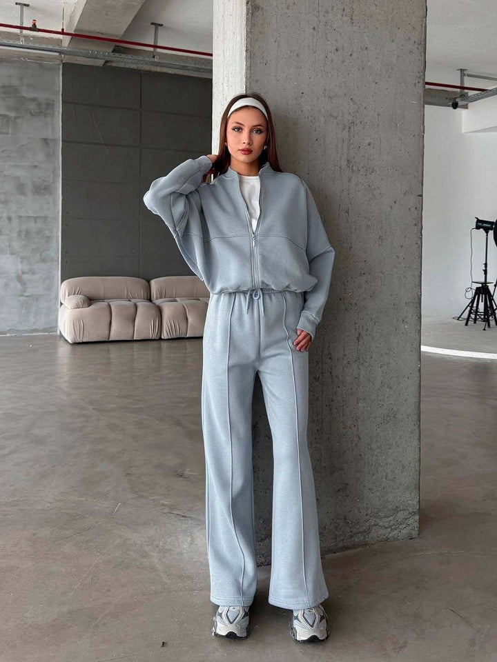 Woman in a zip jacket and wide-leg pants set