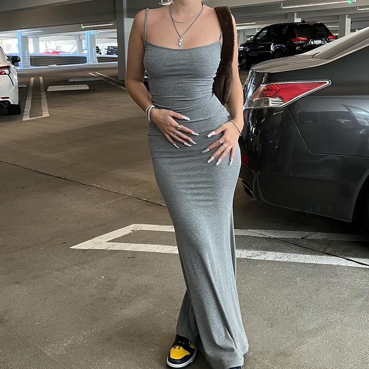 Woman in bodycon maxi dress with mermaid hem