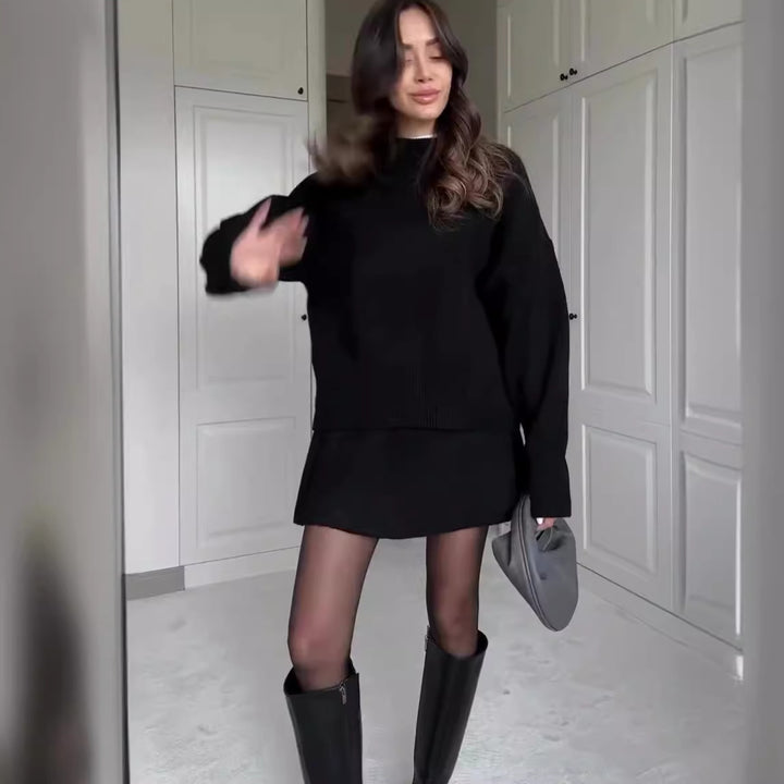 Woman in matching knit sweater and mini skirt set
